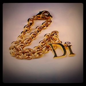 Diamonds International charm bracelet in gold tone
